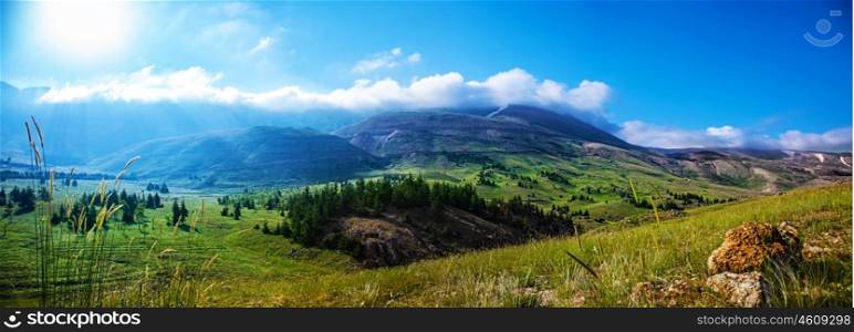 Photo of beautiful mountain landscape, natural background, blue sky with bright sun light, fresh air, green pasture valley in Lebanon mountains, scenic place, traveling and active vacation concept