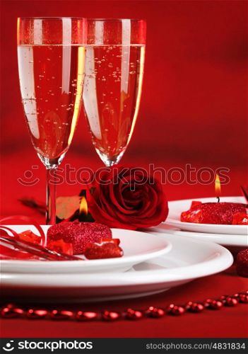 Photo of beautiful red romantic table setting, white festive utensil with romantic decorations, two glass of wine, alcohol beverage, rose flower, Valentine day, romance and love concept