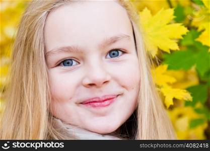 Photo of beautiful smiling girl in autumn