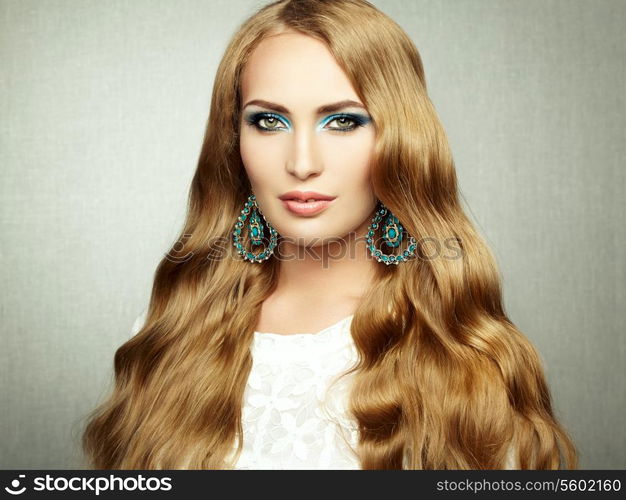 Photo of beautiful woman with magnificent hair. Perfect makeup. Fashion photo