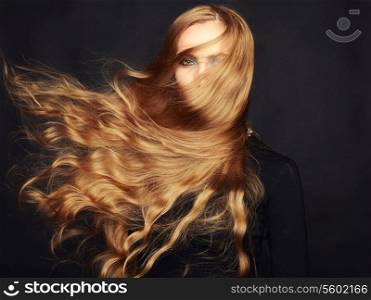 Photo of beautiful woman with magnificent hair. Perfect makeup. Fashion photo