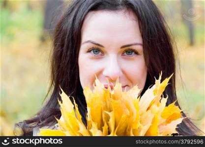 Photo of beautiful young brunette in autumn