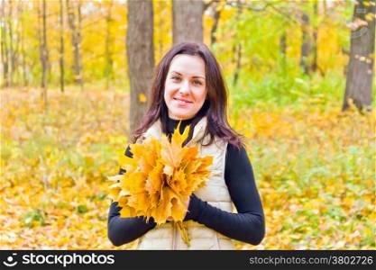 Photo of beautiful young brunette in autumn