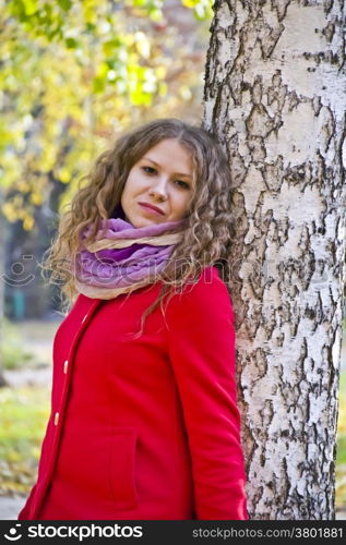 Photo of beautiful young woman in the autumn