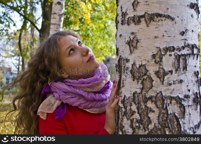 Photo of beautiful young woman in the autumn