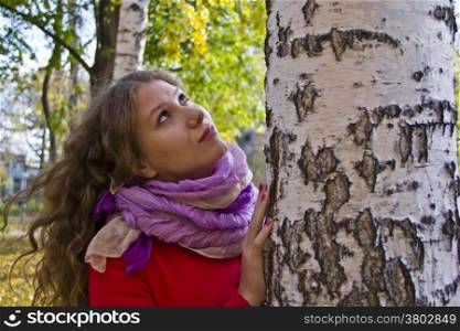 Photo of beautiful young woman in the autumn