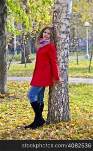 Photo of beautiful young woman in the autumn