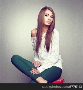 Photo of beautiful young woman in white jacket. Fashion photo