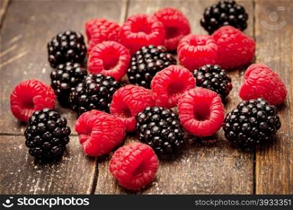 Photo of berries over wooden table