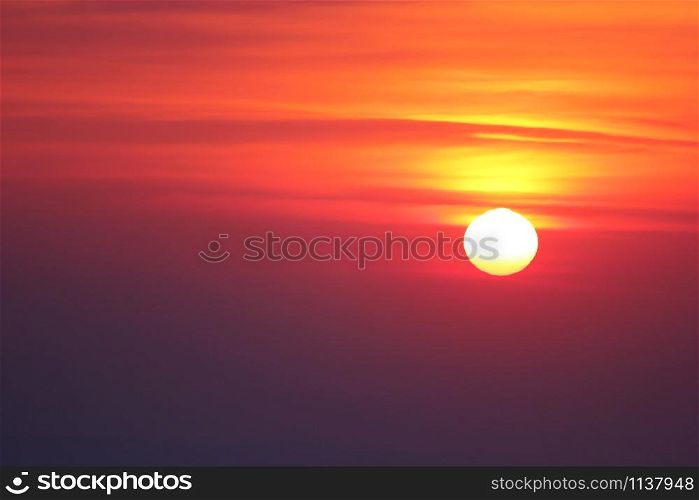 photo of big bright sun on sky background