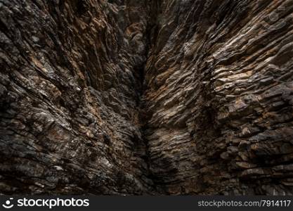 Photo of big crack at mountains with sharp rocks