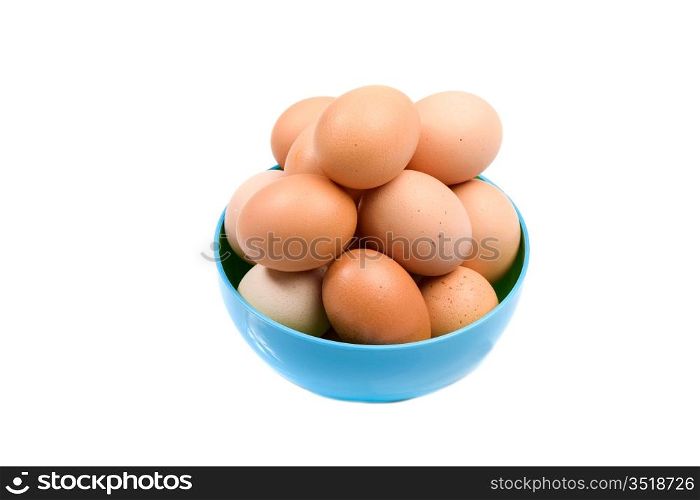 Photo of bowl with many brown hen eggs isolated over white