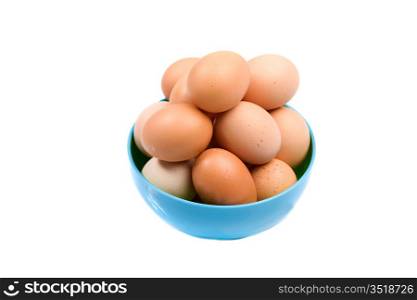 Photo of bowl with many brown hen eggs isolated over white