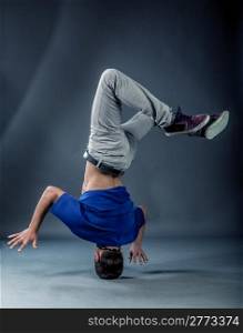 photo of break dancer who is performing his move