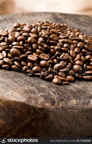 photo of brown delicious roasted coffee beans on wooden table