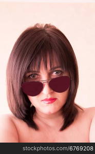 Photo of brunette woman face in sunglass