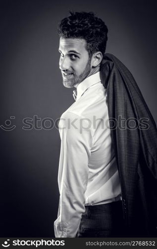 photo of businessman with jacket over his shoulder