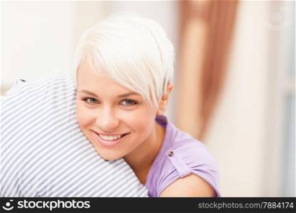 photo of caucasian blonde woman hugging a pillow