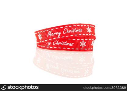 Photo of christmas red ribbon over white isolated background