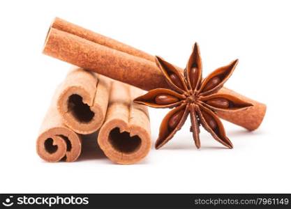 Photo of cinnamon sticks and star anise over white isolated background