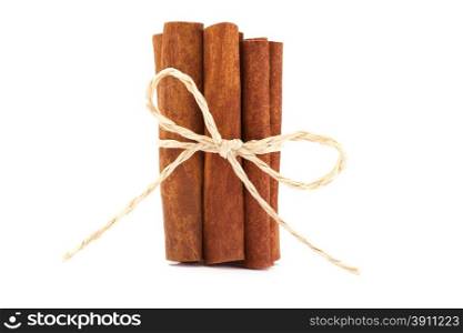 Photo of cinnamon sticks over white isolated background