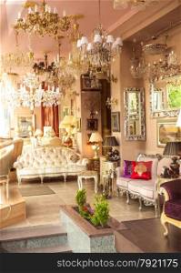 Photo of classic french interior with mirrors, lamps and sofas