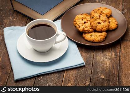 Photo of coffee break while reading a book