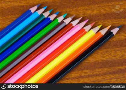 photo of color pencils over a white background
