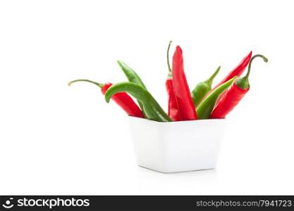 Photo of colorful peppers over white isolated background