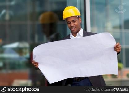 photo of construction engineer with blueprints