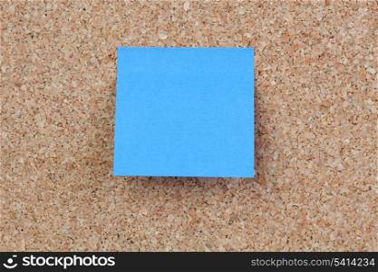 Photo of corkboard with a blue post-it