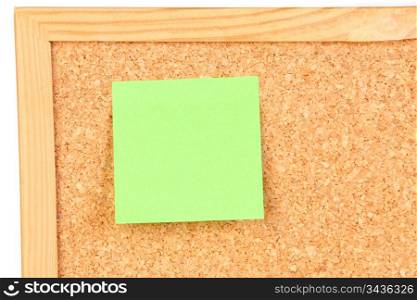 Photo of corkboard with a green post-it