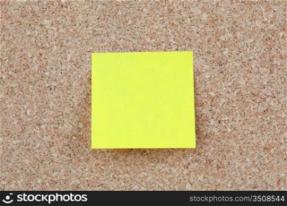 Photo of corkboard with a yellow post-it