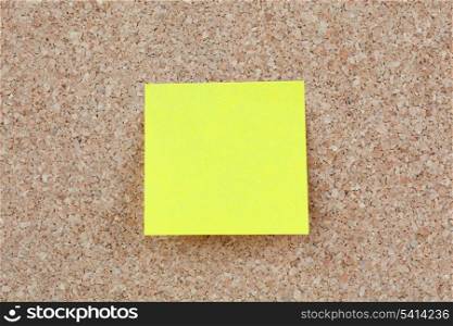 Photo of corkboard with a yellow post-it
