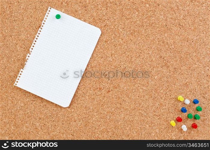Photo of corkboard with blank paper punch