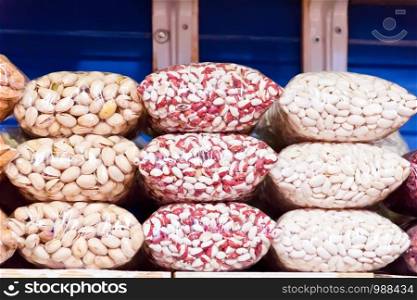 Photo of counter in market place with bean and nuts