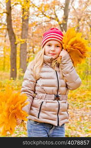 Photo of cute dancing girl in autumn