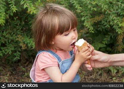 Photo of cute girl are eating icecream in summer time