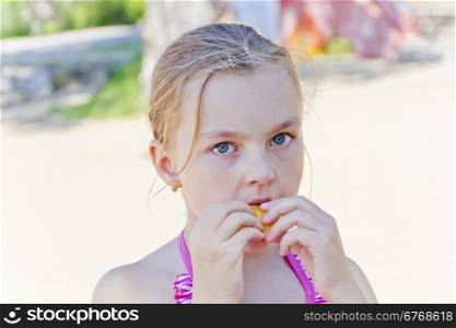 Photo of cute girl biting a meal