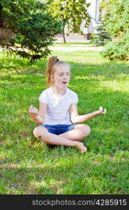 Photo of cute girl in lotus pose