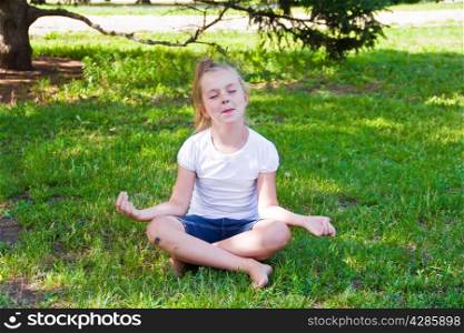 Photo of cute girl in lotus pose with sore knee
