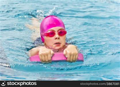 Photo of cute girl in swimming pool