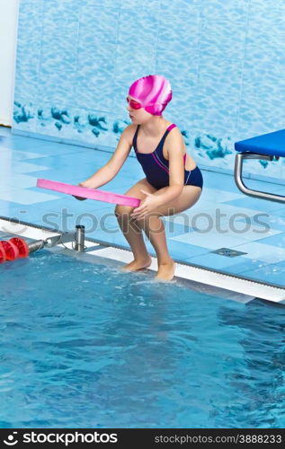 Photo of cute girl in swimming pool