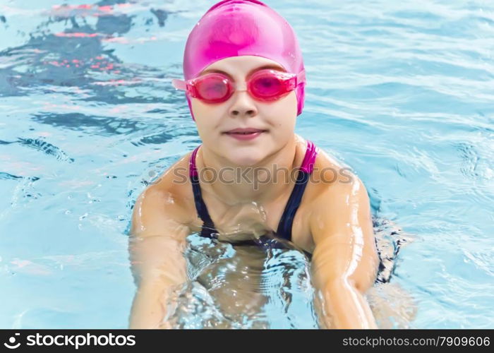 Photo of cute girl in swimming pool