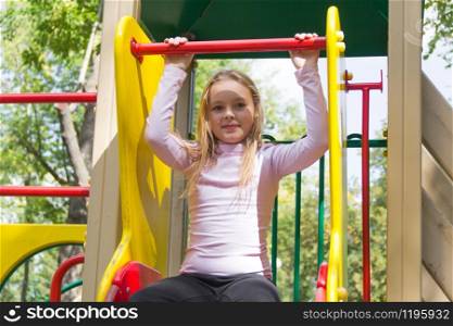 Photo of cute girl on gymnastic stairway