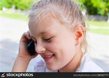 Photo of cute girl talking by cellular