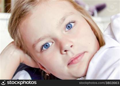 Photo of cute girl with big blue eyes