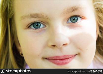 Photo of cute girl with big blue eyes