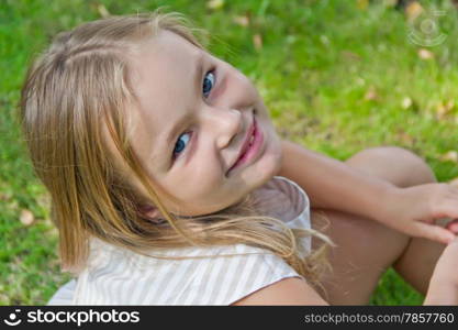 Photo of cute girl with big blue eyes