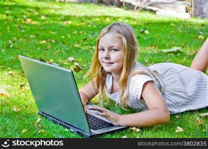 Photo of cute girl with laptop in summer